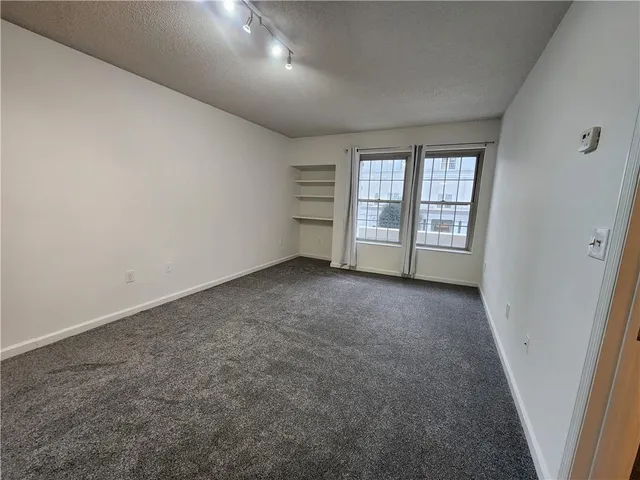 an empty room with windows
