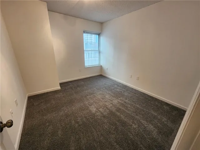 a view of hallway with wooden floor