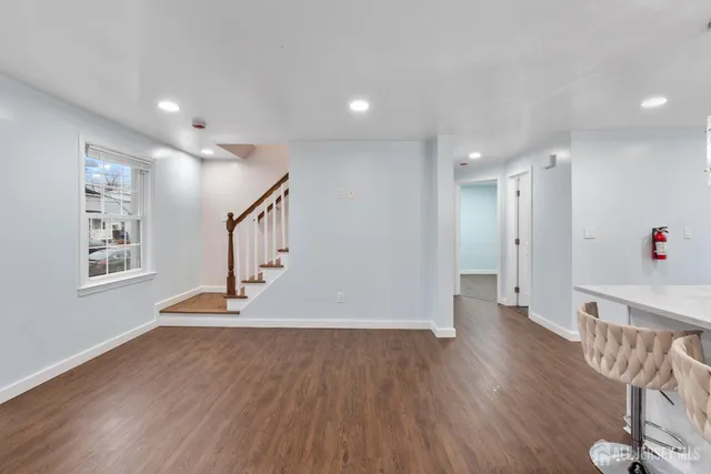 a view of entryway with wooden floor
