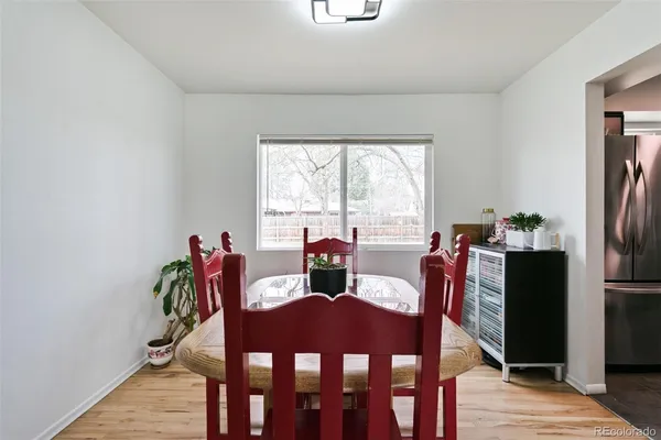 a view of a dining room with furniture window and outside view