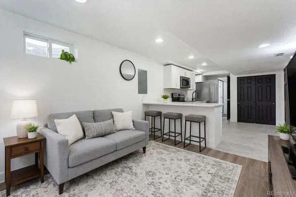 a living room with furniture and a table