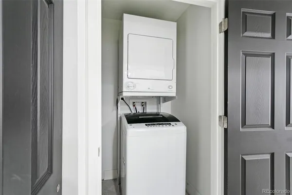 a utility room with a sink dryer and washer