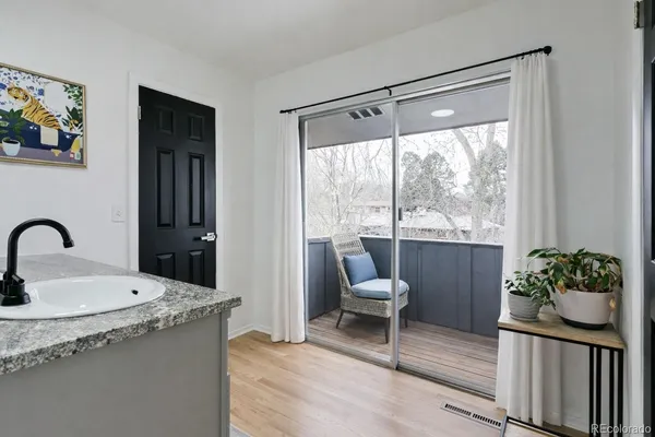 a living room with granite countertop furniture and a potted plant