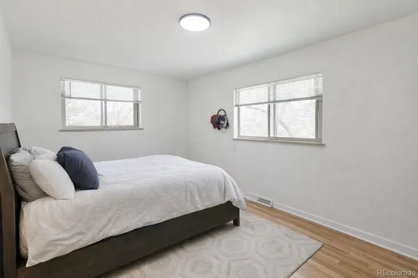 a bedroom with a bed and window