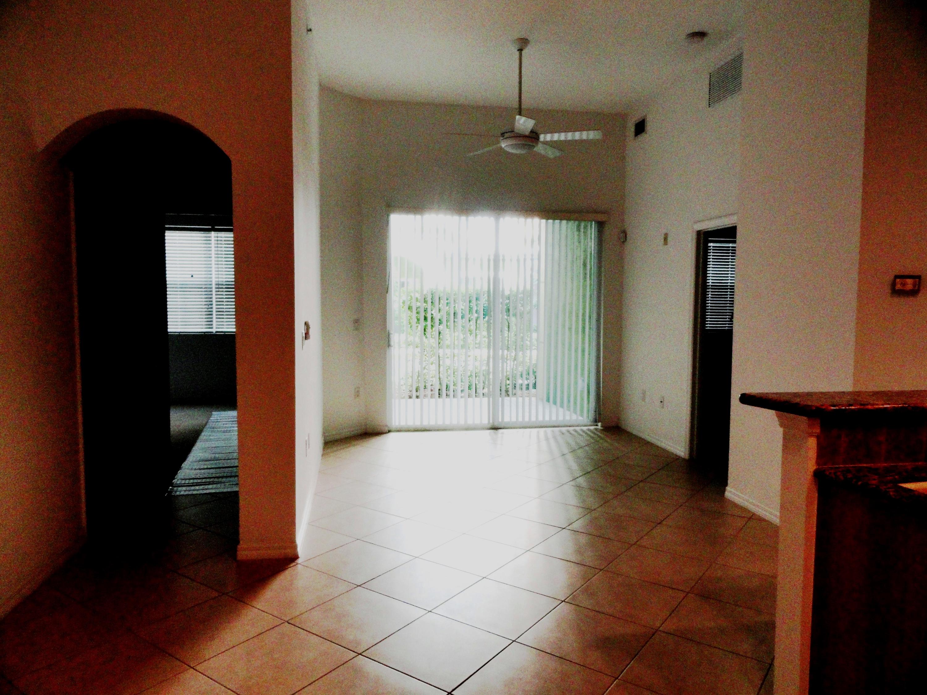1605 Renaissance Commons Boulevard, Unit 121 Boynton Beach, FL 33426 - Photo 2 of 18 Living Rm & Hall to 2nd Bedroom & Bath