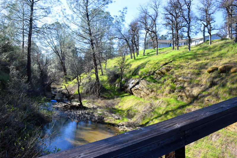 28899 Whitmore Road Whitmore, CA 96096 - Photo 27 of 43 View of house and creek from footbridge