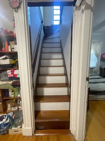 a view of a hallway view with furniture