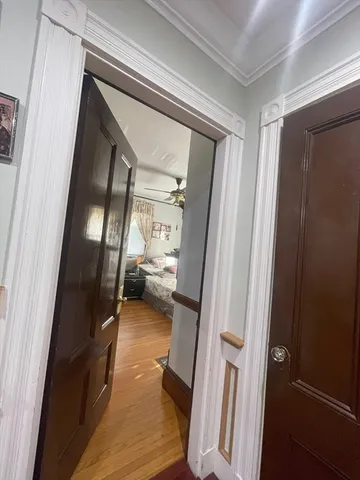 a living room with furniture a window and gym equipment