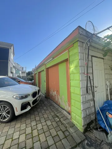 a front view of a house with parking space