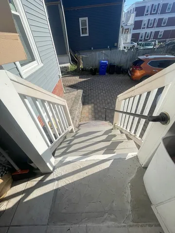 a view of a porch with furniture and a stove