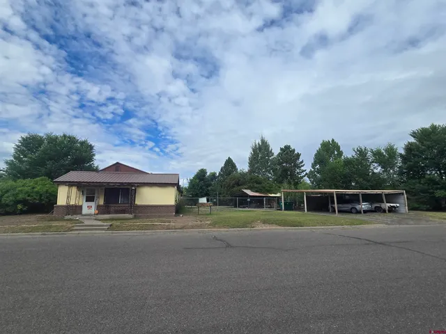 a swimming pool with outdoor seating and yard