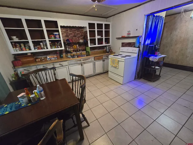 a view of kitchen with furniture and flat screen tv