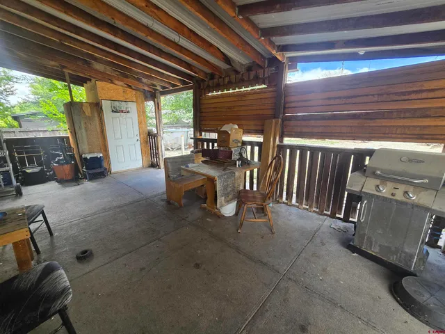 a view of a backyard with a patio