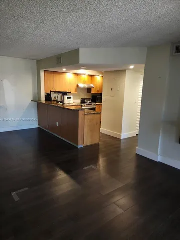 a view of open space with wooden floor