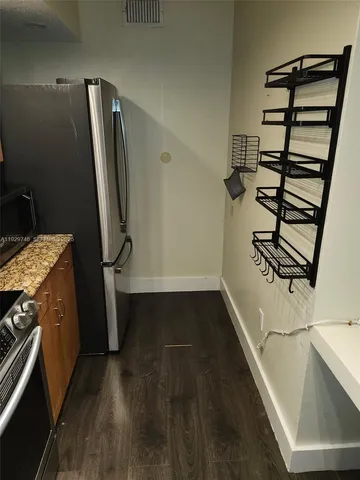 a view of storage and utility room with empty racks