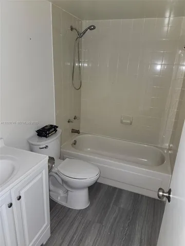 a bathroom with a sink a toilet and a bathtub