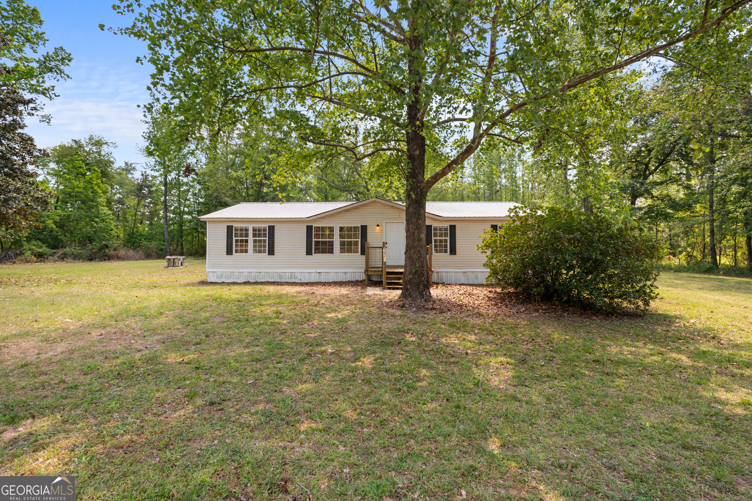 a house with trees in front of it