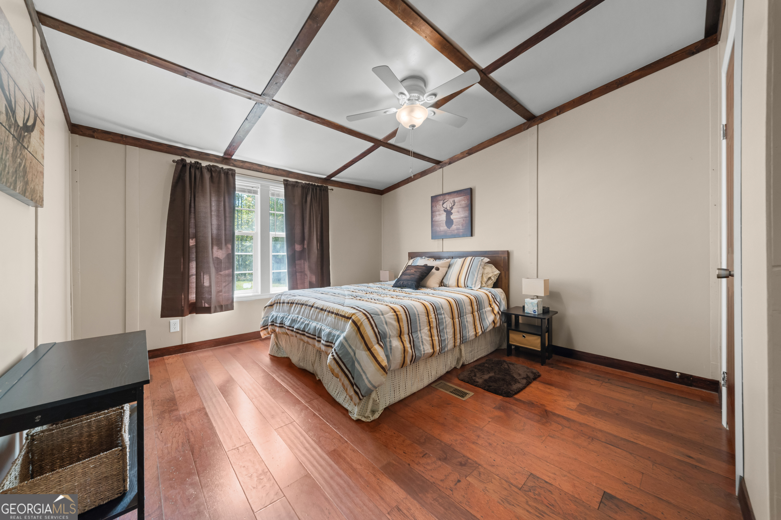 3347 Dickey Road Millen, GA 30442 - Photo 18 of 31 a bedroom with a bed and wooden floor