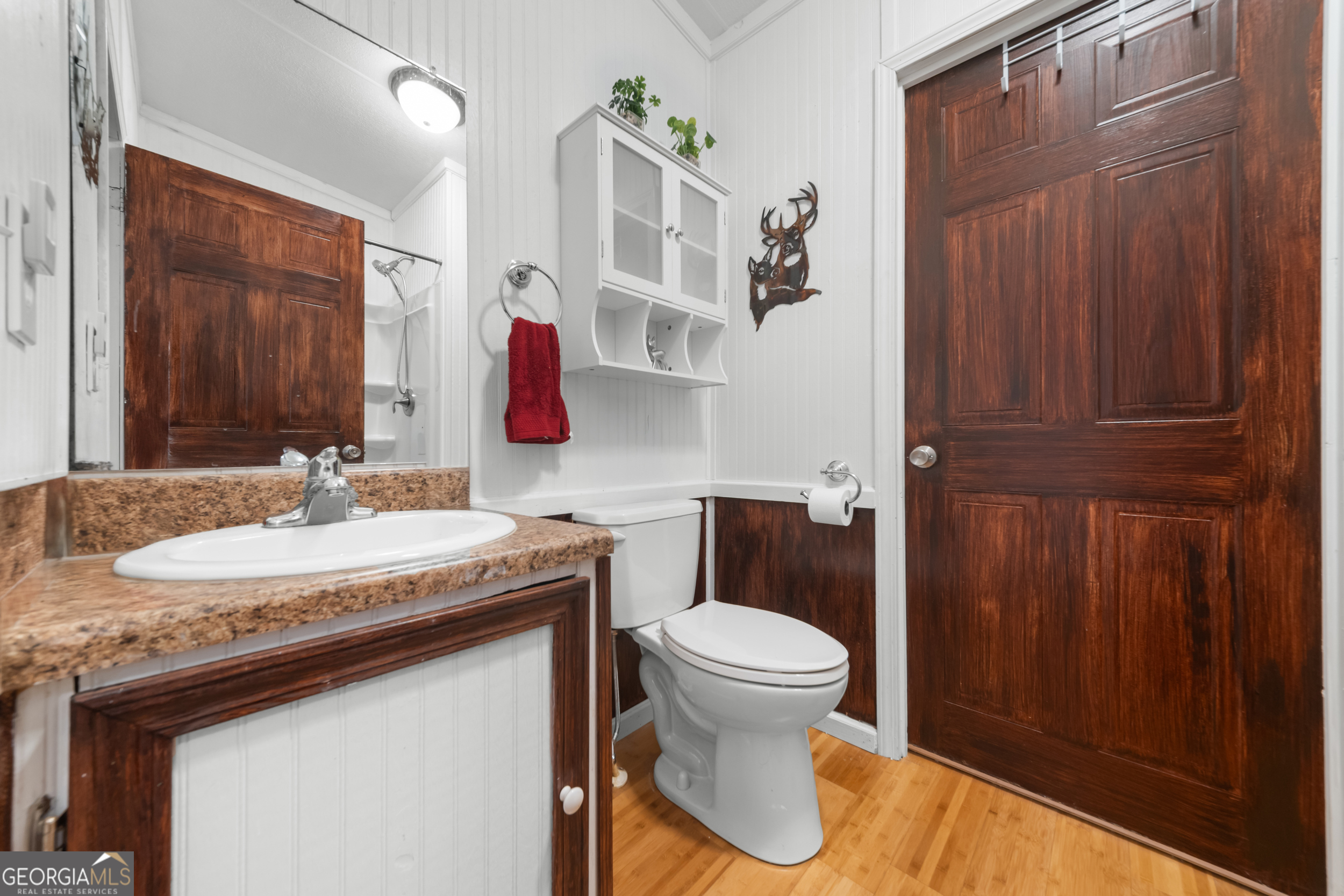 3347 Dickey Road Millen, GA 30442 - Photo 24 of 31 a bathroom with a sink and a mirror