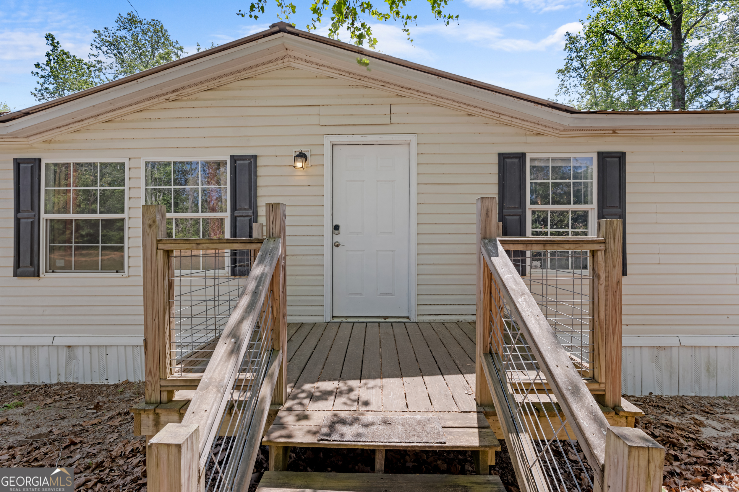 3347 Dickey Road Millen, GA 30442 - Photo 5 of 31 a view of balcony with furniture and stairs