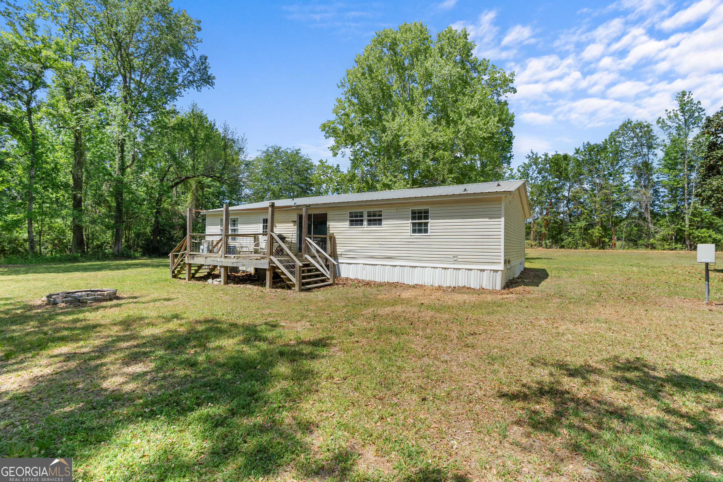 3347 Dickey Road Millen, GA 30442 - Photo 6 of 31 a view of a house with backyard and trees