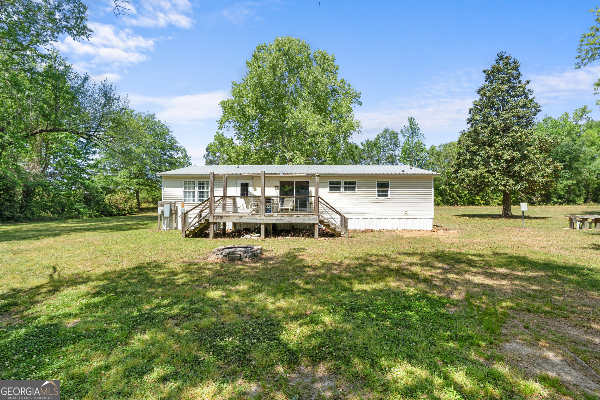 3347 Dickey Road Millen, GA 30442 - Photo 7 of 31 a view of a house with backyard and sitting area