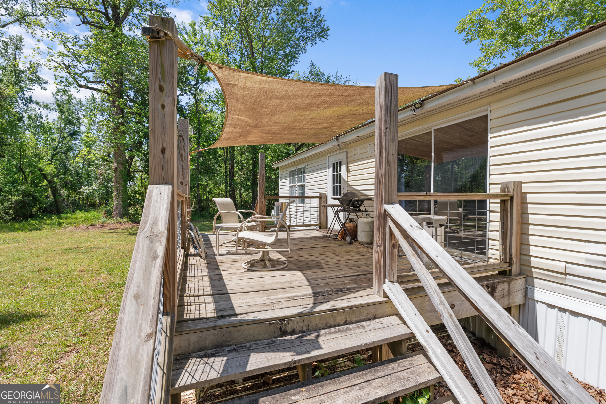 3347 Dickey Road Millen, GA 30442 - Photo 8 of 31 a view of a patio with chairs next to a yard