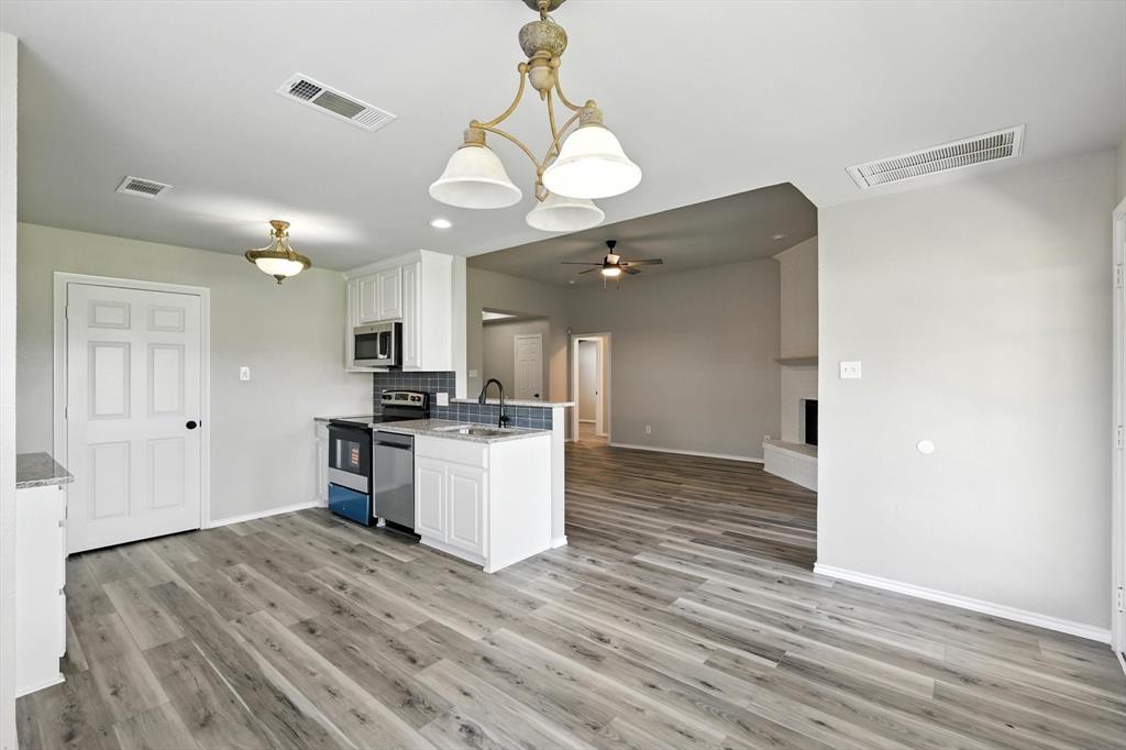 621 Torero Trail Oak Point, TX 75068 - Photo 15 of 34 a view of kitchen and wooden floor