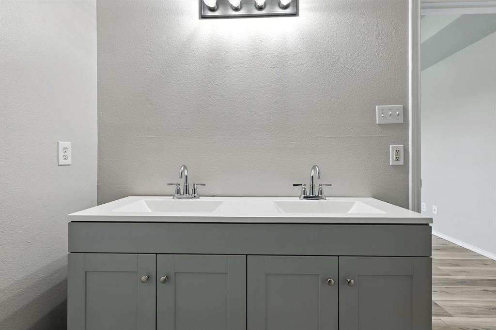 621 Torero Trail Oak Point, TX 75068 - Photo 22 of 34 a bathroom with a sink and a mirror