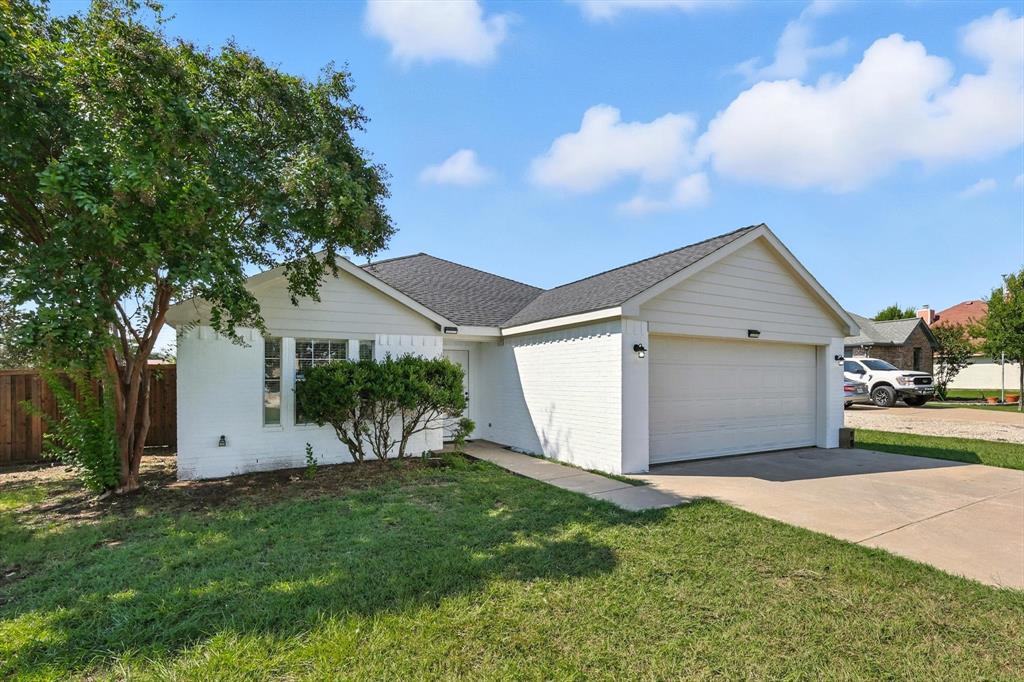 621 Torero Trail Oak Point, TX 75068 - Photo 3 of 34 a view of a white house with a big yard and large tree