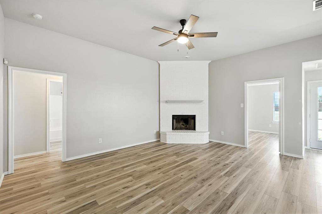 621 Torero Trail Oak Point, TX 75068 - Photo 8 of 34 a view of an empty room with wooden floor