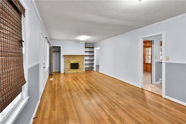 a kitchen with granite countertop a refrigerator stove top oven and sink