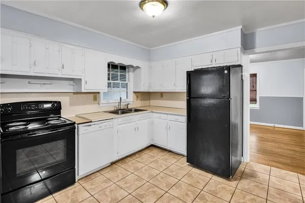 a kitchen with stainless steel appliances a refrigerator and a sink