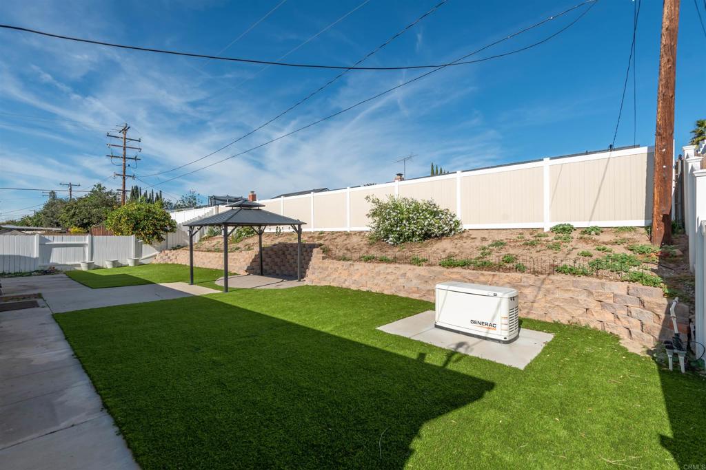 1693 Downing Street Simi Valley, CA 93065 - Photo 28 of 39 pictured is Whole-home Generator in backyard.