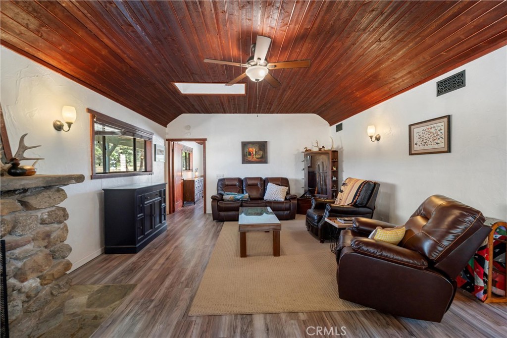 60861 Burnt Valley Road Anza, CA 92539 - Photo 15 of 66 a living room with furniture and wooden floor