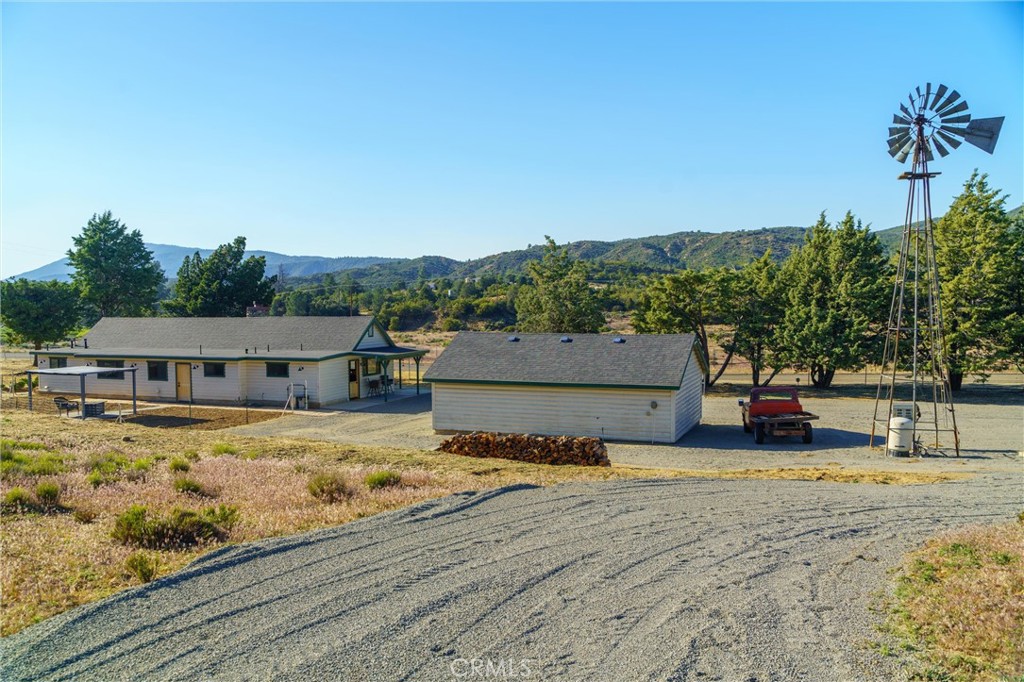60861 Burnt Valley Road Anza, CA 92539 - Photo 39 of 66 a view of a house with a yard