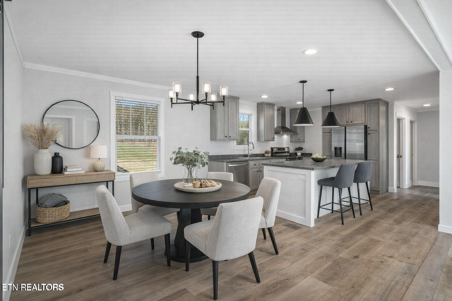 132 Cedarock Lane Rutledge, TN 37861 - Photo 11 of 42 a view of a dining room and livingroom with furniture wooden floor a chandelier