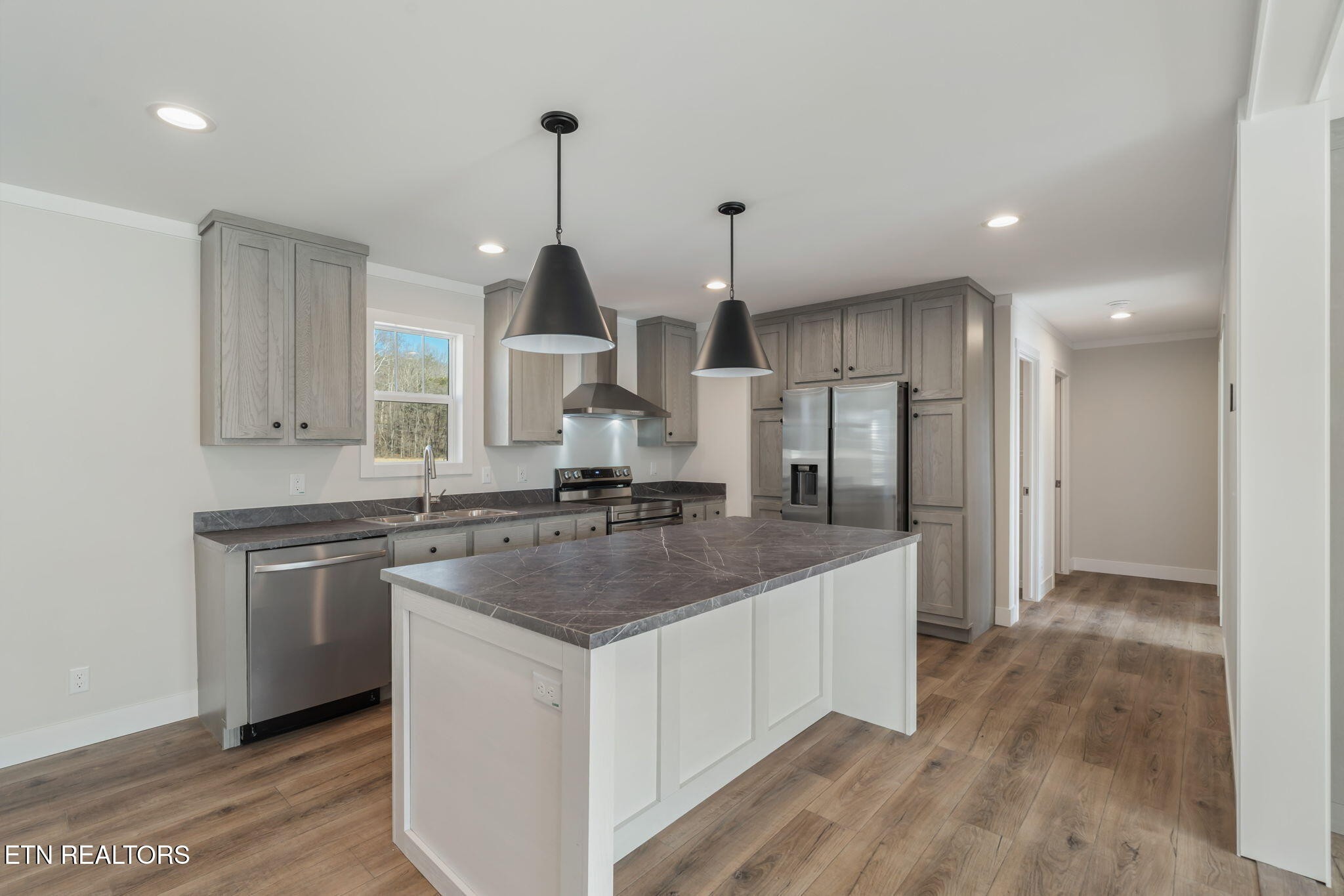 132 Cedarock Lane Rutledge, TN 37861 - Photo 13 of 42 a kitchen with stainless steel appliances granite countertop a sink a refrigerator and a stove