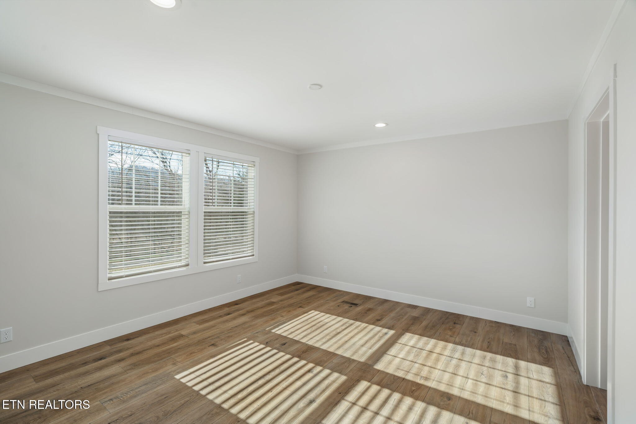 132 Cedarock Lane Rutledge, TN 37861 - Photo 21 of 42 a view of an empty room with wooden floor and a window