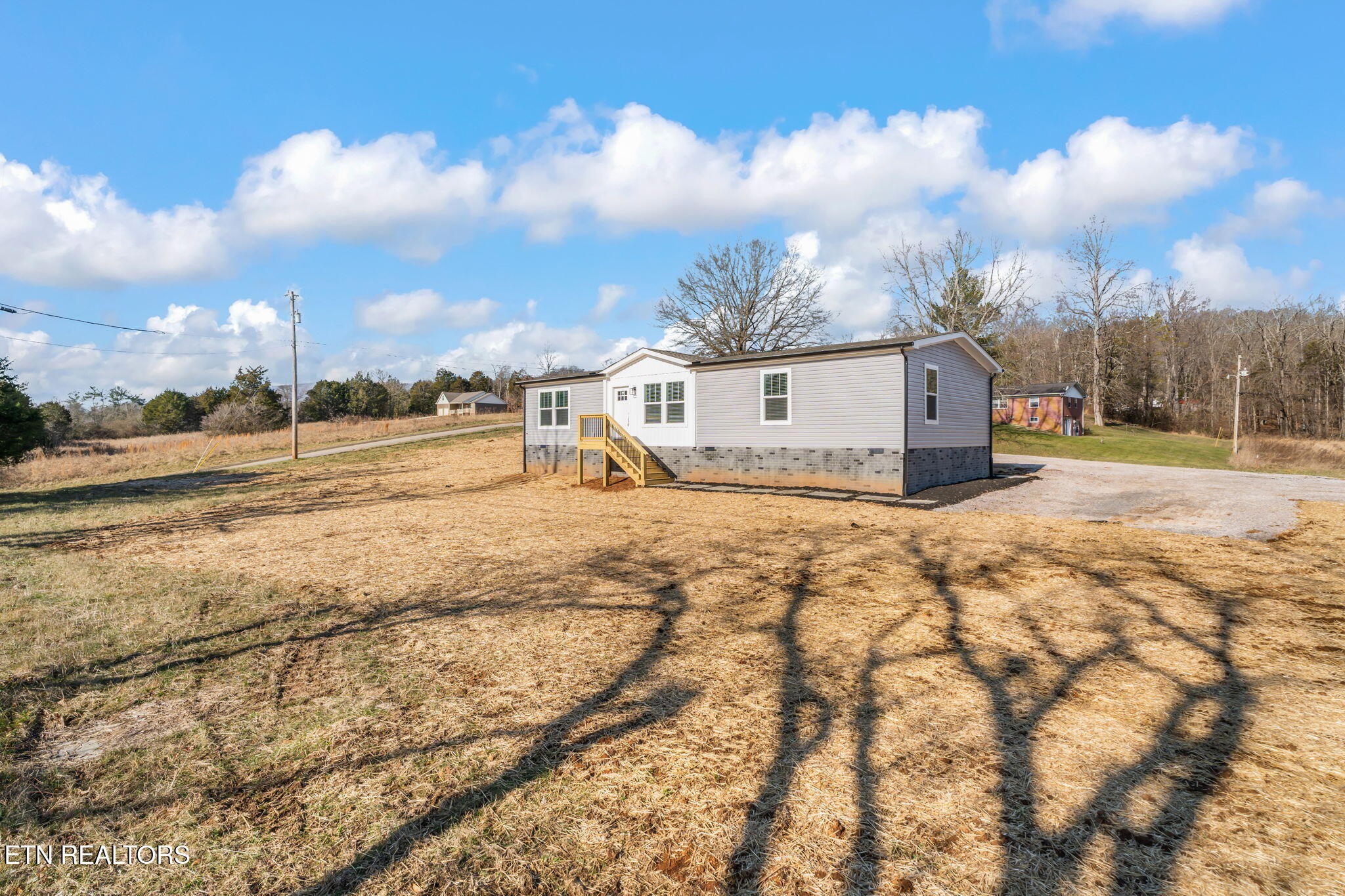 132 Cedarock Lane Rutledge, TN 37861 - Photo 3 of 42 a view of a terrace with wooden fence