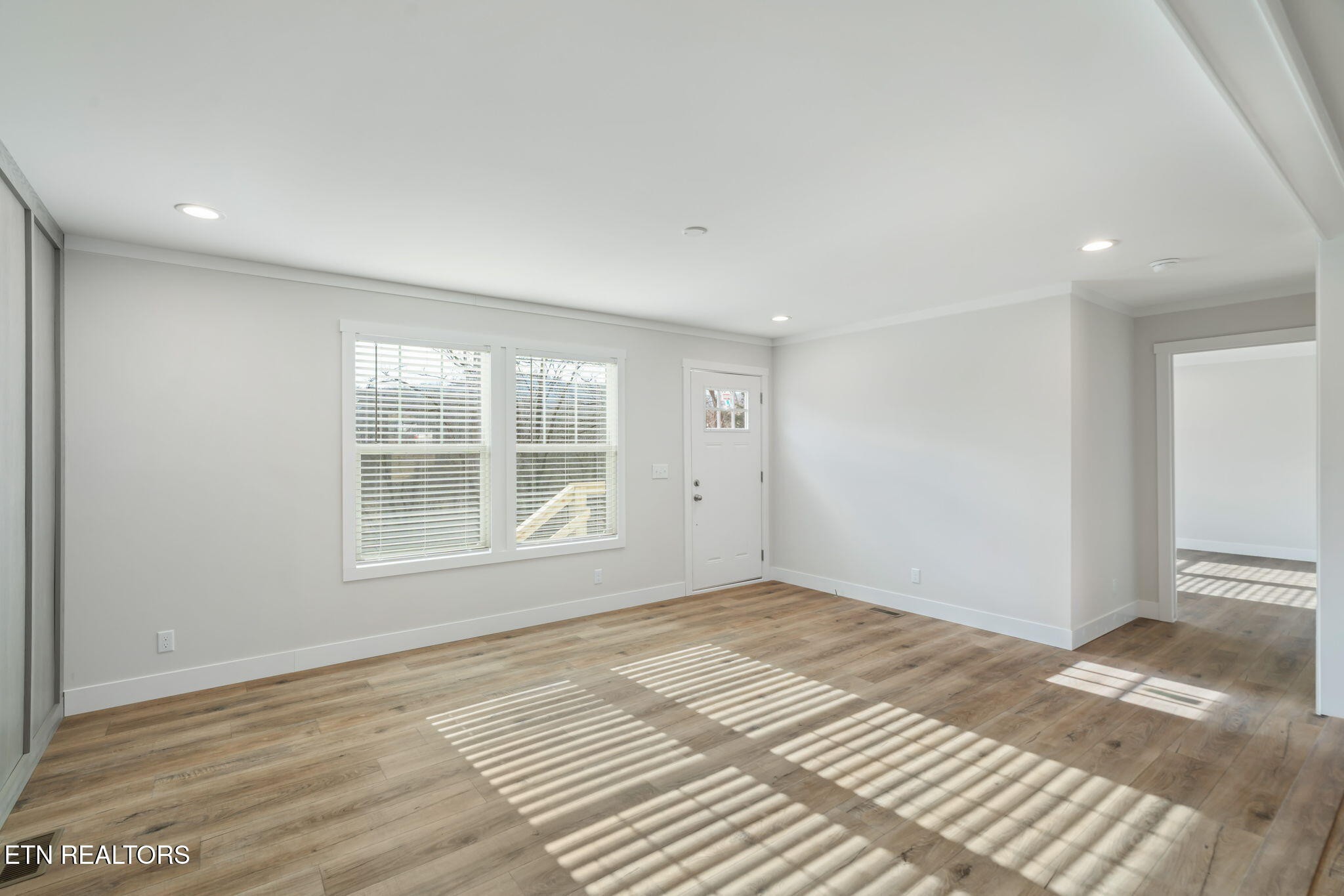 132 Cedarock Lane Rutledge, TN 37861 - Photo 9 of 42 a view of an empty room with wooden floor and a window