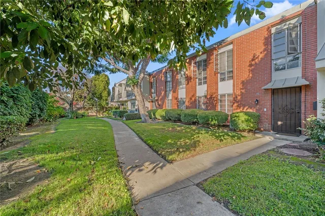 a view of a garden with a building