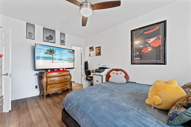 a bedroom with bed and window