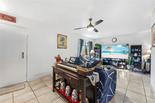a living room with fireplace furniture and a flat screen tv