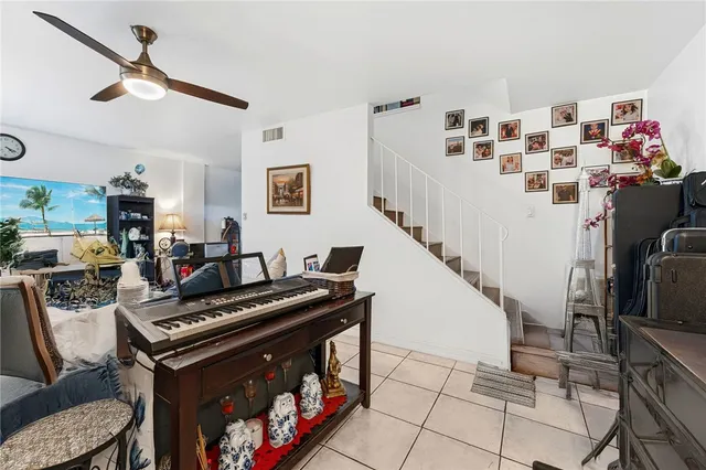 a view of a livingroom with furniture and workspace