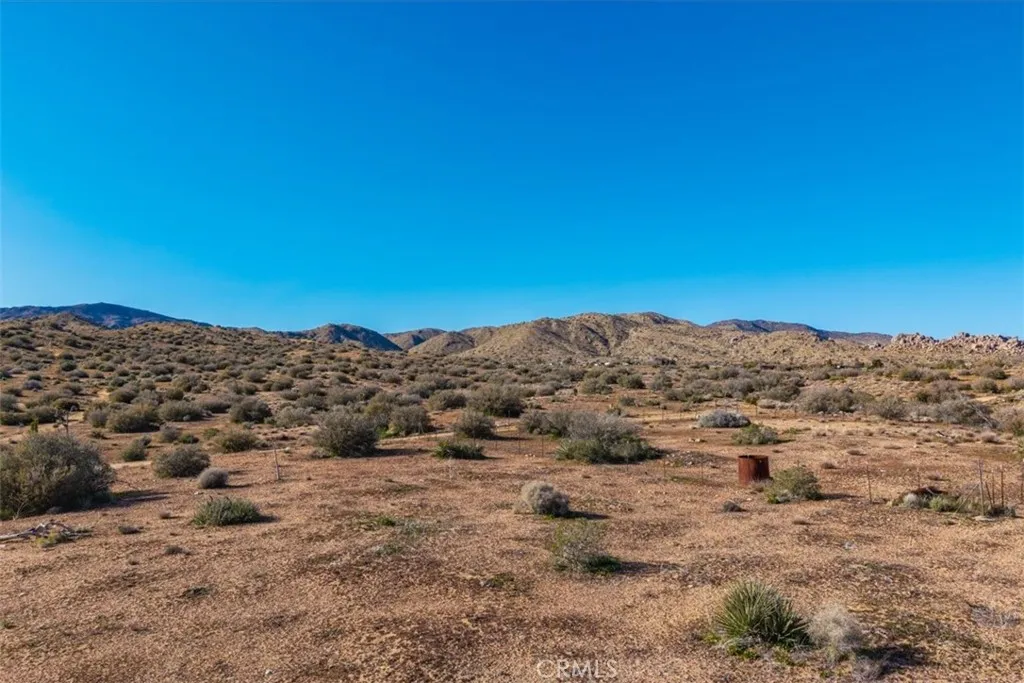 3263 Apache Pioneertown, CA 92268 - Photo 15 of 24 a view of a large building with a mountain in the background