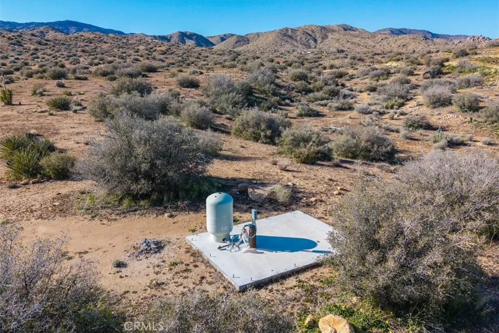 3263 Apache Pioneertown, CA 92268 - Photo 2 of 24 a view of a backyard with wooden fence