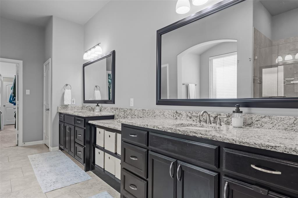 417 Prairie Run Aledo, TX 76008 - Photo 19 of 40 Dual sinks and countertops in primary bathroom give plenty of space to get ready in the mornings.