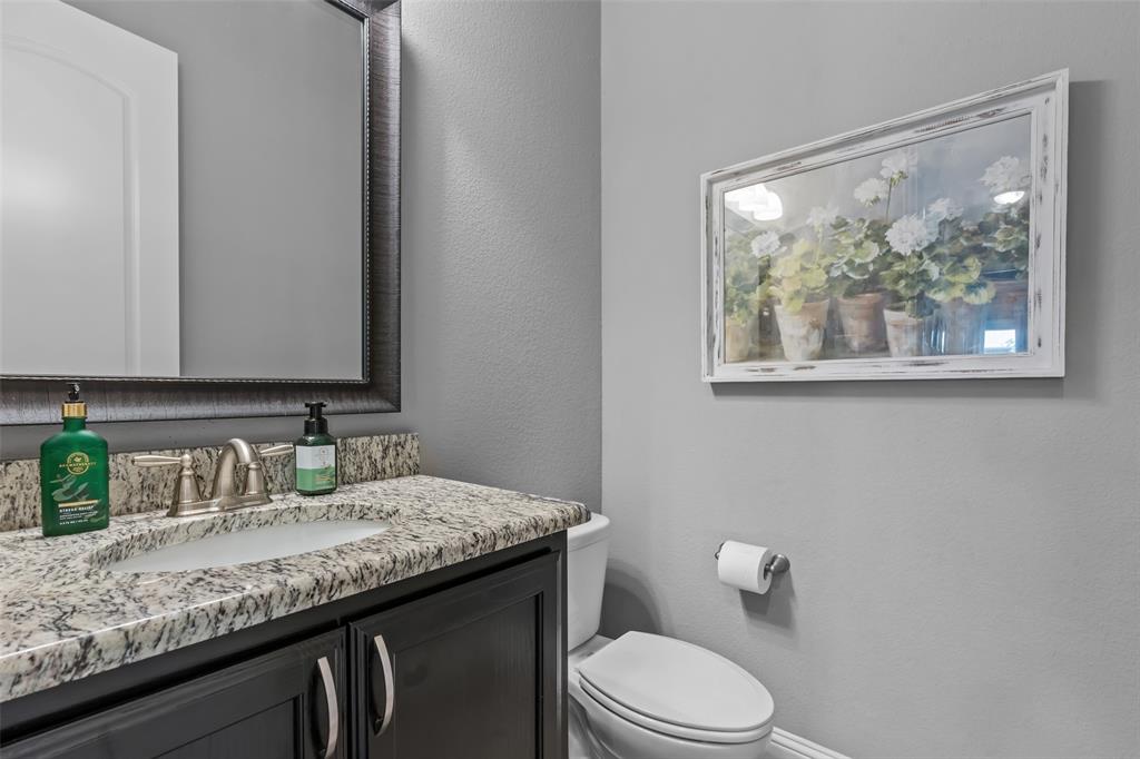 417 Prairie Run Aledo, TX 76008 - Photo 23 of 40 Half bathroom downstairs is off hallway by living room.