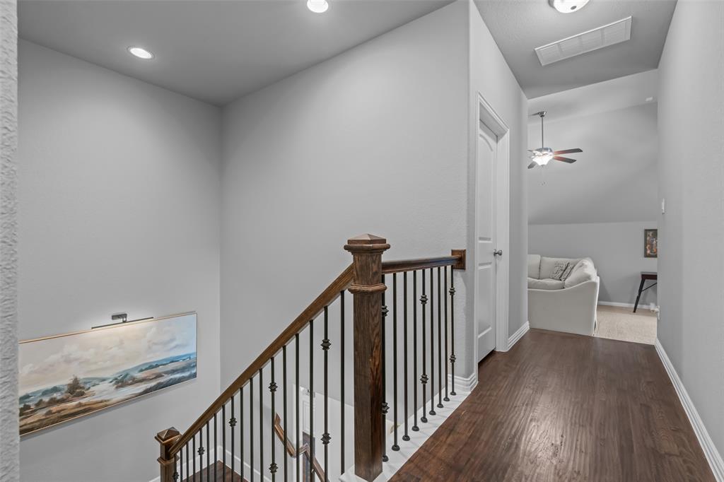 417 Prairie Run Aledo, TX 76008 - Photo 27 of 40 Second floor hallway has door to attic space, making it easy for adding to storage.